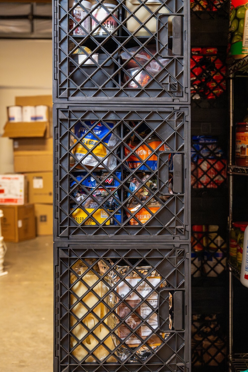 UbeCube&trade; crate tower storing freeze dried meals and long term food supplies in a modular prepper pantry setup.