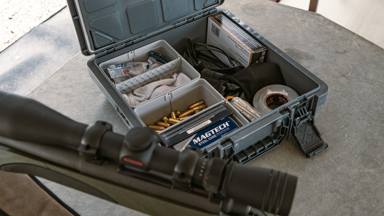 CrateShot ammo storage box with organized compartments holding ammunition and gear for range or field use