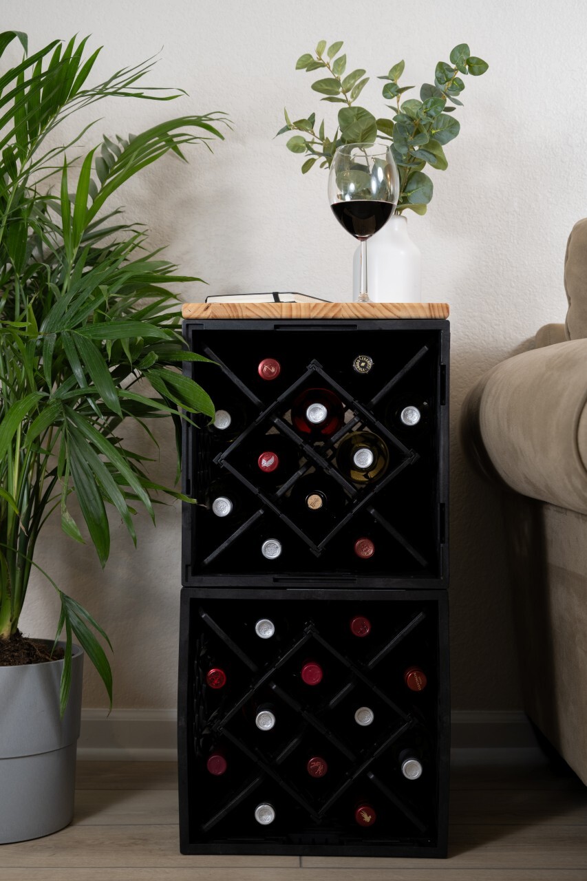 Two stacked CrateWine&trade; modular wine storage crates used as vertical wine tower in living room.